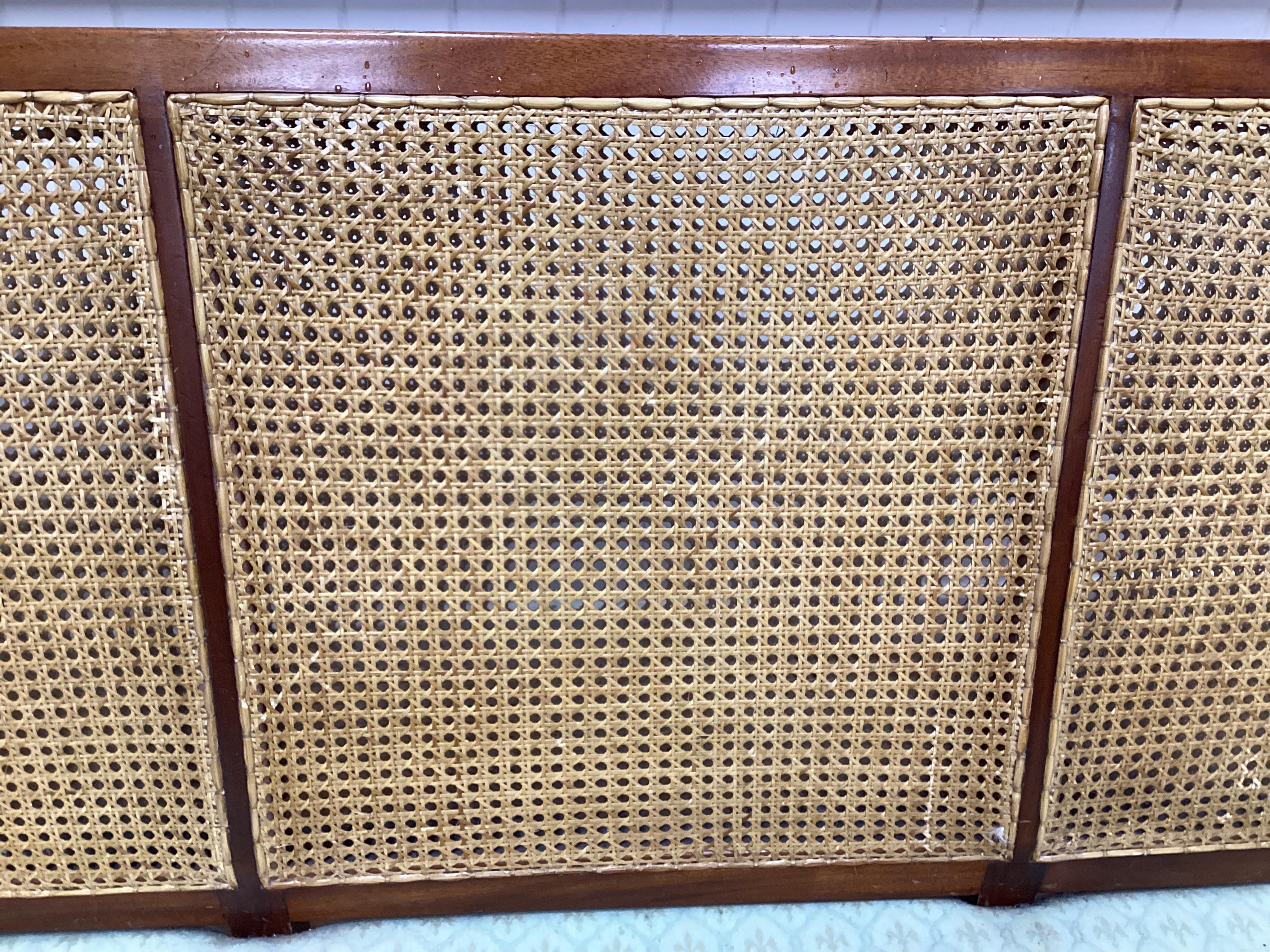 A mahogany double caned bergere settee with loose cushion seat and back, width 178cm, depth 78cm, height 87cm